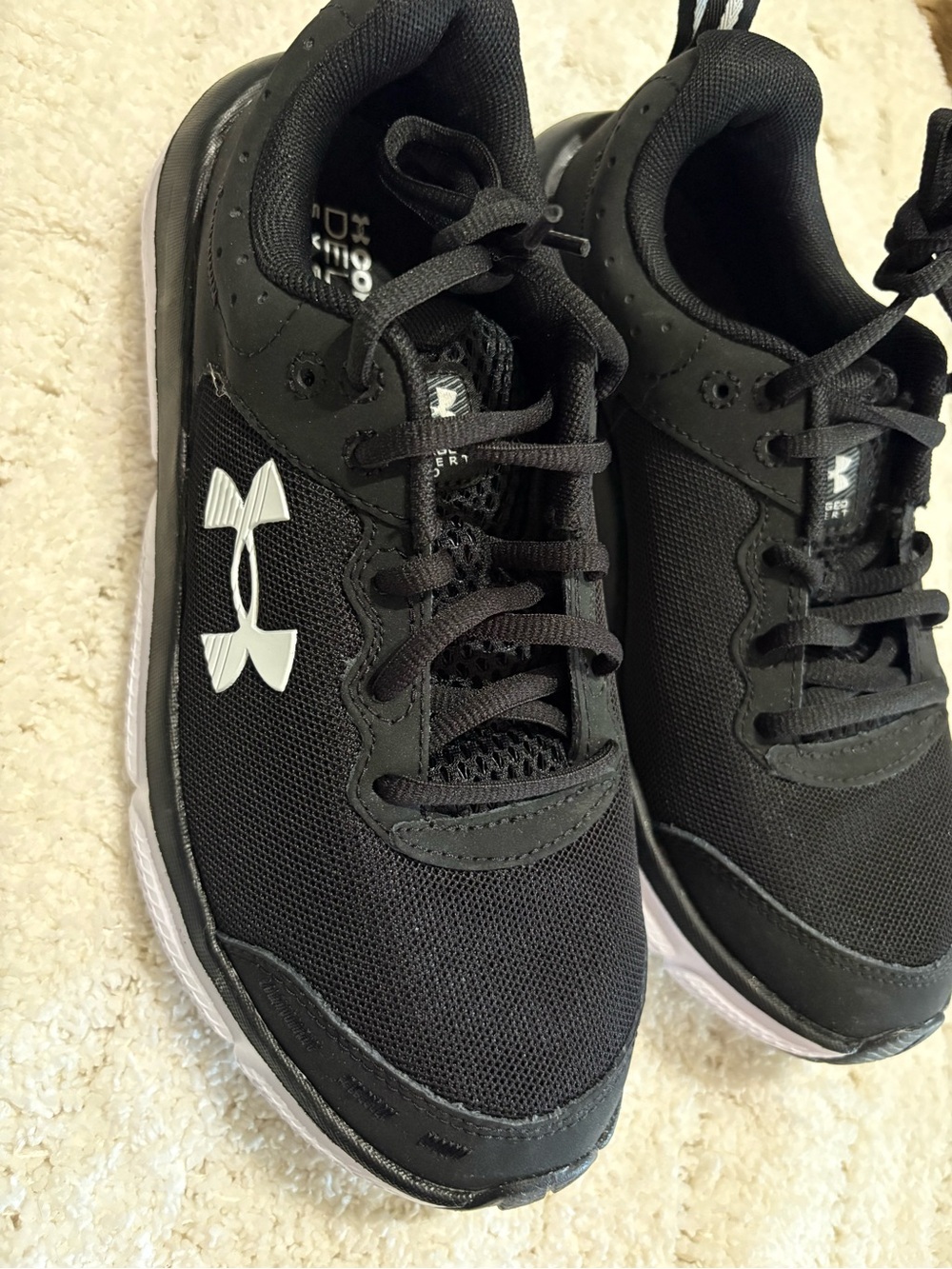 Under Armour Black Sneakers with White Logo - charged assert 10